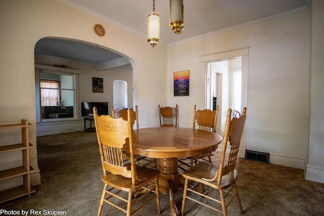 892 W Forest Ave, Muskegon, MI 49441 - dining area featuring arched walkways, carpet, and ornamental molding