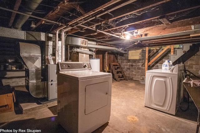 892 W Forest Ave, Muskegon, MI 49441 - unfinished below grade area with gas water heater, washer and clothes dryer, and stairway