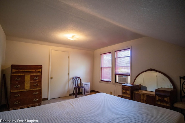 892 W Forest Ave, Muskegon, MI 49441 - carpeted bedroom featuring a textured ceiling, lofted ceiling, and cooling unit