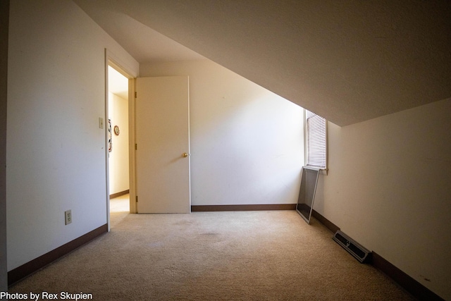 892 W Forest Ave, Muskegon, MI 49441 - additional living space featuring light colored carpet and baseboards