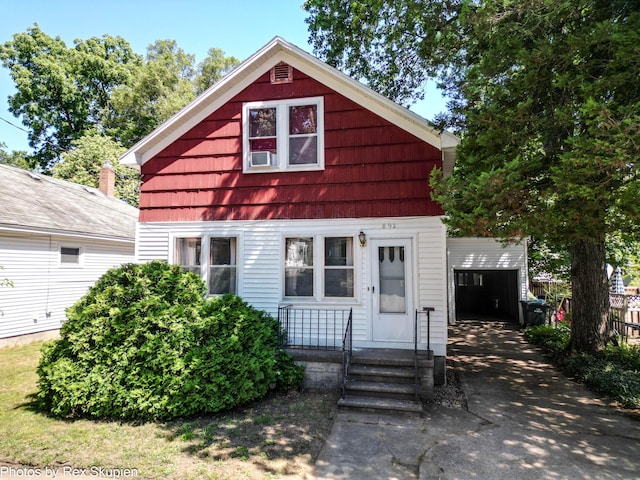 892 W Forest Ave, Muskegon, MI 49441 - view of front of property featuring a garage and asphalt driveway