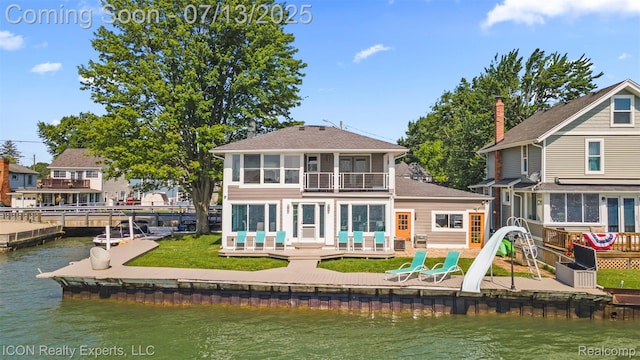 106 St Clair River Dr, Algonac, MI 48001 - rear view of property with a water view, a balcony, a patio, and a shingled roof