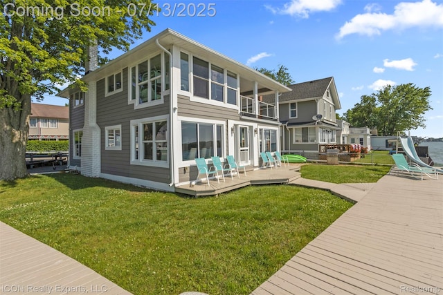 106 St Clair River Dr, Algonac, MI 48001 - rear view of property featuring a balcony, a wooden deck, and a yard