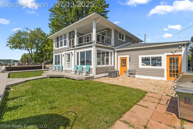 106 St Clair River Dr, Algonac, MI 48001 - rear view of house featuring a balcony, a yard, a patio, a wooden deck, and french doors