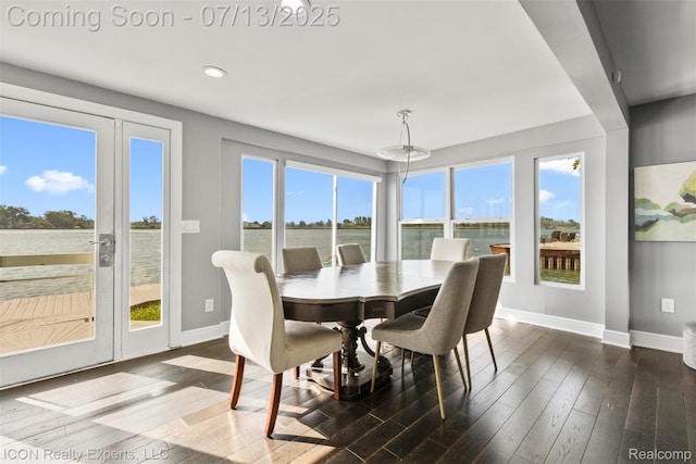 106 St Clair River Dr, Algonac, MI 48001 - dining area with healthy amount of natural light, wood finished floors, a water view, and recessed lighting