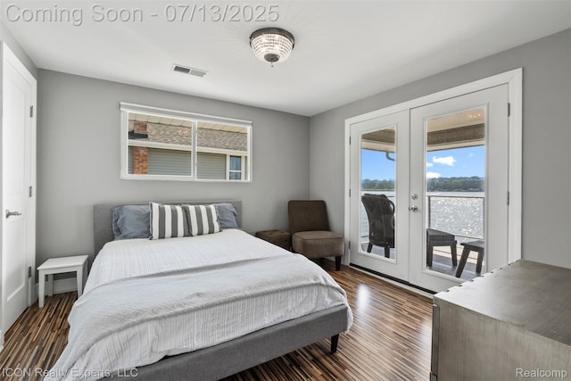 106 St Clair River Dr, Algonac, MI 48001 - bedroom with french doors, access to exterior, dark wood finished floors, and a water view