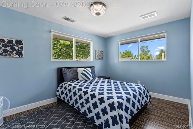 106 St Clair River Dr, Algonac, MI 48001 - bedroom with baseboards and dark wood-type flooring