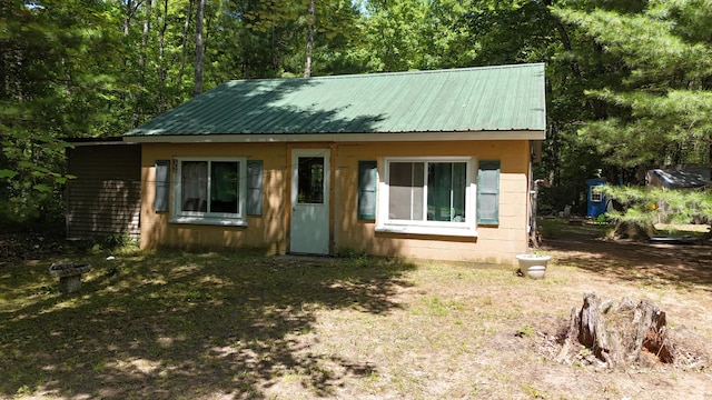 17644 Stronach Dam Rd, Wellston, MI 49689 - view of front of property featuring concrete block siding and a metal roof