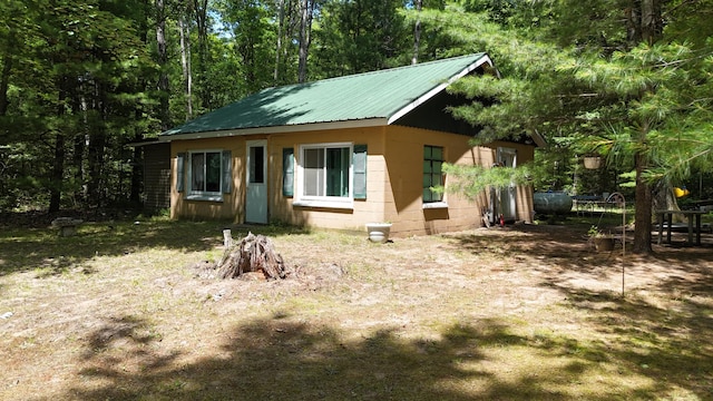 17644 Stronach Dam Rd, Wellston, MI 49689 - view of front of property with concrete block siding and a metal roof