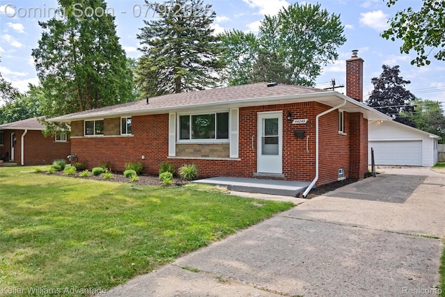 44249 Donley Dr, Sterling Heights, MI 48314 - view of front of home with a chimney, brick siding, an outbuilding, a front yard, and a detached garage