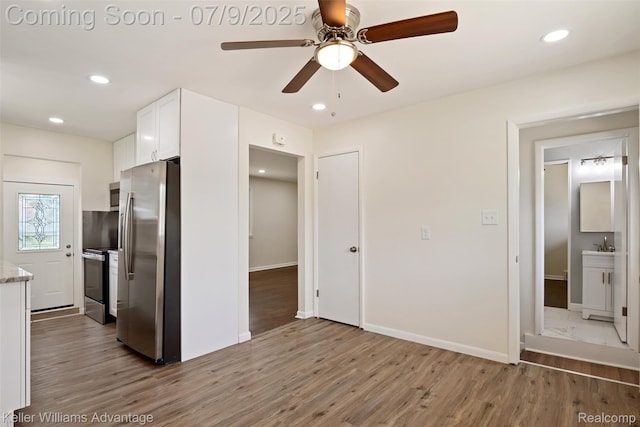 44249 Donley Dr, Sterling Heights, MI 48314 - kitchen with stainless steel appliances, white cabinetry, wood finished floors, ceiling fan, and recessed lighting