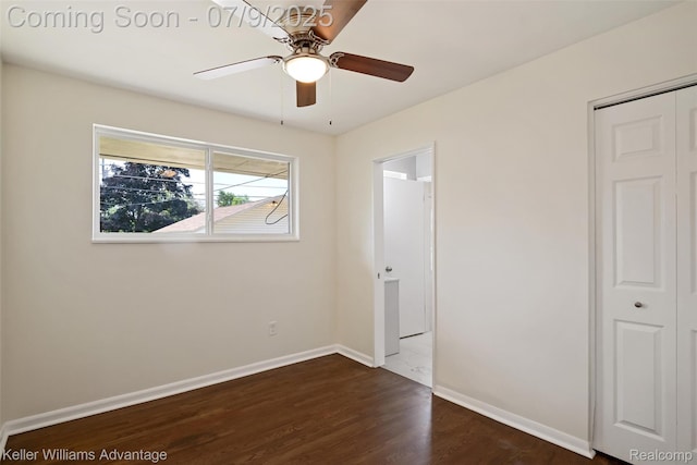 44249 Donley Dr, Sterling Heights, MI 48314 - unfurnished bedroom with dark wood-style floors, a closet, and ceiling fan