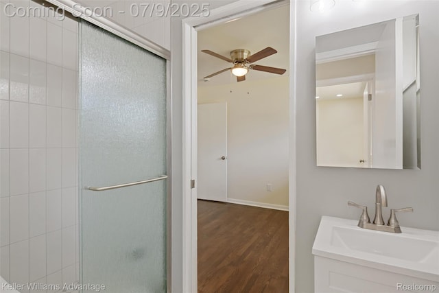 44249 Donley Dr, Sterling Heights, MI 48314 - bathroom with a shower with door, ceiling fan, wood finished floors, and vanity