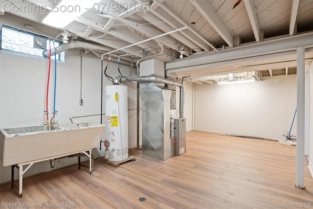 44249 Donley Dr, Sterling Heights, MI 48314 - below grade area featuring water heater, wood finished floors, and heating unit