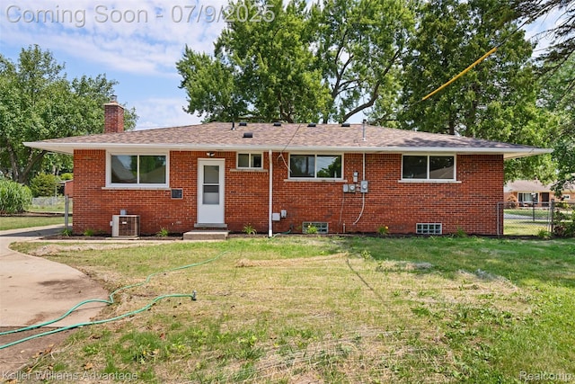 44249 Donley Dr, Sterling Heights, MI 48314 - rear view of property with brick siding, a chimney, roof with shingles, and entry steps
