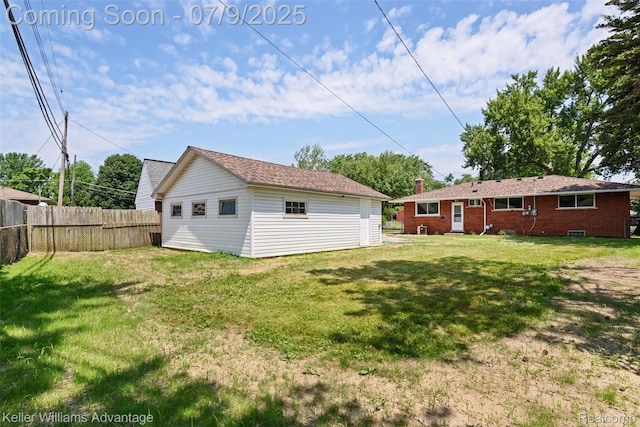 44249 Donley Dr, Sterling Heights, MI 48314 - rear view of house with brick siding and an outdoor structure