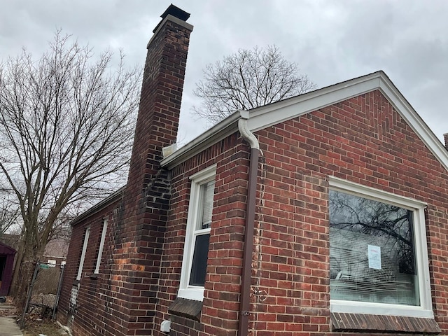 8518 Sussex St, Detroit, MI 48228 - view of property exterior featuring brick siding and a chimney