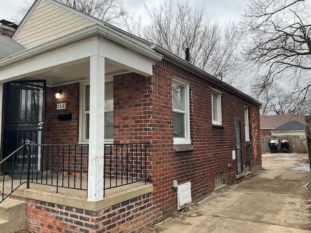 8518 Sussex St, Detroit, MI 48228 - view of home's exterior featuring brick siding, a porch, and driveway