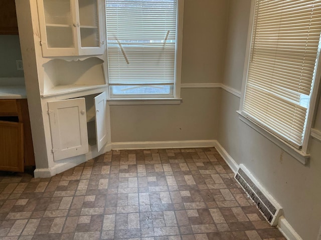 8518 Sussex St, Detroit, MI 48228 - unfurnished dining area with brick patterned floors