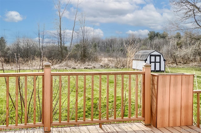 11247 Irish Rd, Otisville, MI 48463 - wooden deck featuring a storage unit and a yard