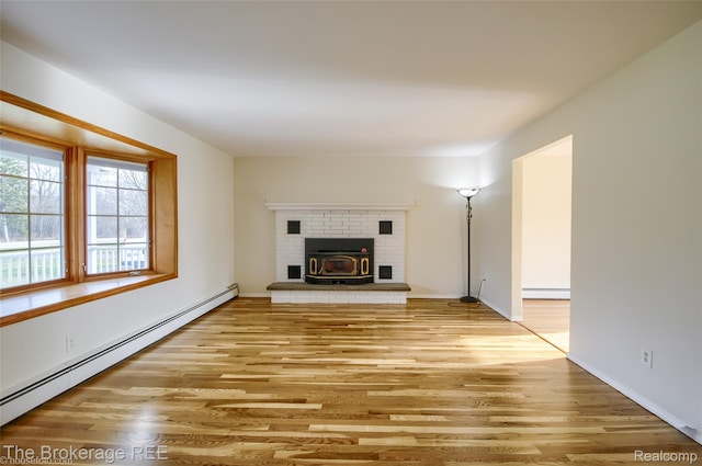 11247 Irish Rd, Otisville, MI 48463 - unfurnished living room with a baseboard heating unit, light wood finished floors, and a fireplace