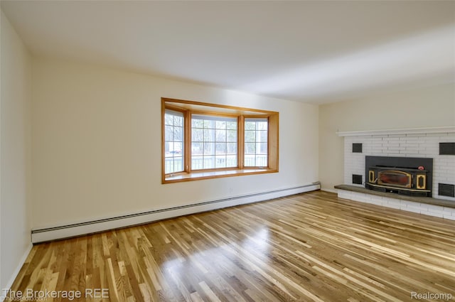 11247 Irish Rd, Otisville, MI 48463 - unfurnished living room with a baseboard heating unit and wood finished floors