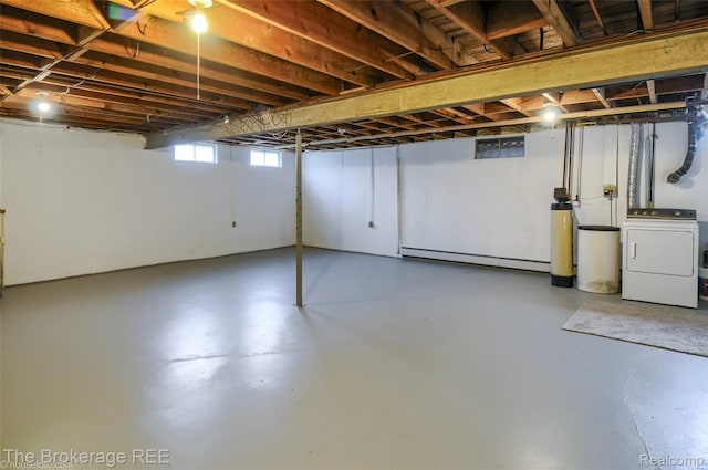 11247 Irish Rd, Otisville, MI 48463 - basement featuring washer / clothes dryer, a water softener system, and a baseboard heating unit