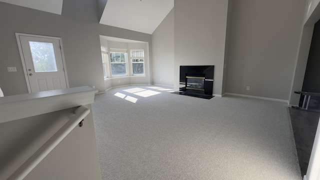 41664 Tera Ln, Novi, MI 48375 - unfurnished living room with carpet, a fireplace with flush hearth, and high vaulted ceiling