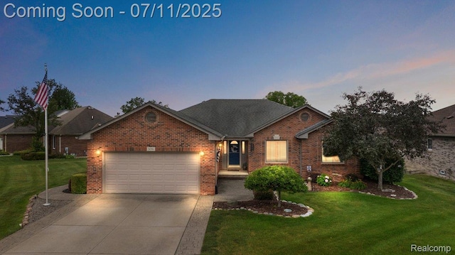 54561 Laurel Dr, Macomb, MI 48042 - traditional home featuring a garage, a yard, and brick siding