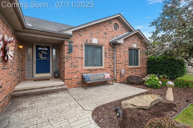 54561 Laurel Dr, Macomb, MI 48042 - doorway to property with brick siding
