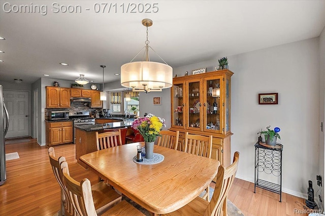 54561 Laurel Dr, Macomb, MI 48042 - dining area with light wood-type flooring, a chandelier, and recessed lighting