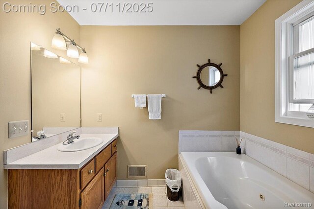 54561 Laurel Dr, Macomb, MI 48042 - full bathroom featuring vanity, tile patterned flooring, a whirlpool tub, and plenty of natural light