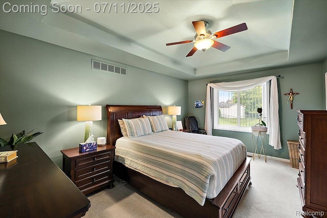 54561 Laurel Dr, Macomb, MI 48042 - carpeted bedroom featuring a raised ceiling and ceiling fan