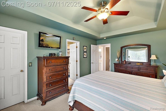 54561 Laurel Dr, Macomb, MI 48042 - bedroom with a tray ceiling, light carpet, and a ceiling fan