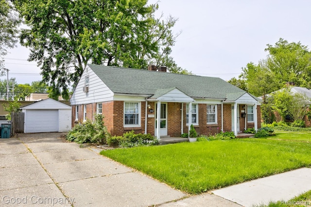 1977 Princeton Rd, Troy, MI 48072 - view of front of house featuring brick siding, an outbuilding, a detached garage, driveway, and a front lawn