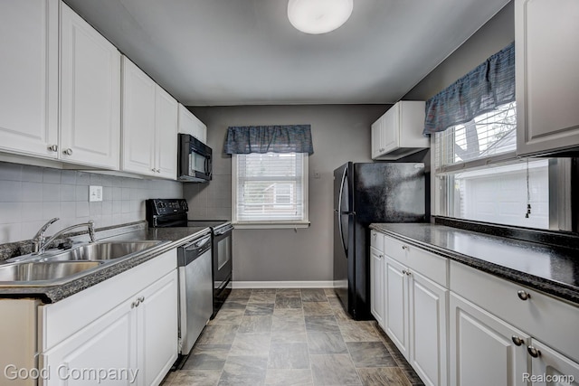1977 Princeton Rd, Troy, MI 48072 - kitchen featuring black appliances, white cabinetry, dark countertops, and decorative backsplash