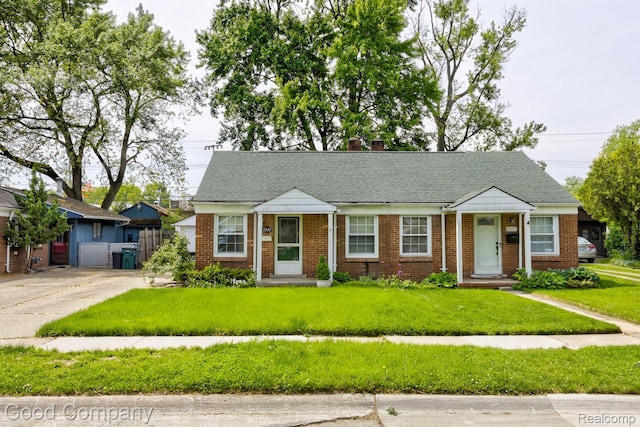 1977 Princeton Rd, Troy, MI 48072 - view of front of house with a chimney, brick siding, and a shingled roof