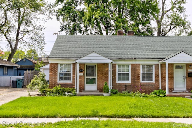 1977 Princeton Rd, Troy, MI 48072 - view of front of home with a chimney, brick siding, and a shingled roof