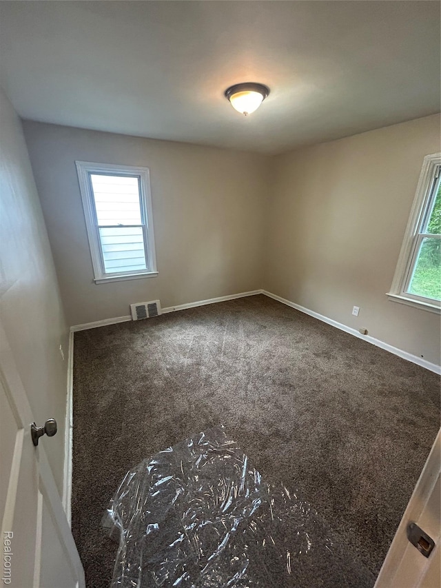 3381 S Ethel St, Detroit, MI 48217 - carpeted empty room featuring baseboards