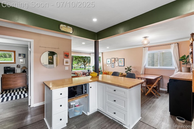 23316 Brookdale Blvd, Saint Clair Shores, MI 48082 - kitchen with wood counters, white cabinetry, dark wood-style floors, healthy amount of natural light, and recessed lighting
