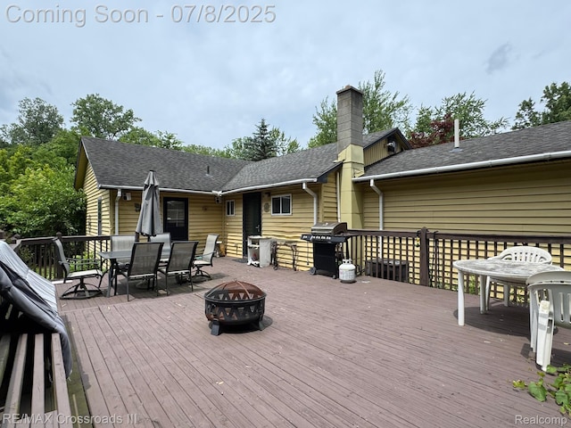 6785 Belleville Rd, Van Buren, MI 48111 - wooden deck featuring an outdoor fire pit, outdoor dining space, and grilling area