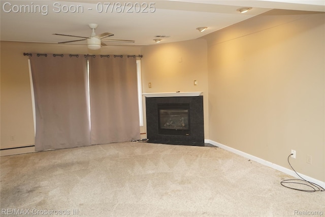 6785 Belleville Rd, Van Buren, MI 48111 - unfurnished living room with ceiling fan, carpet floors, a tiled fireplace, and a baseboard radiator