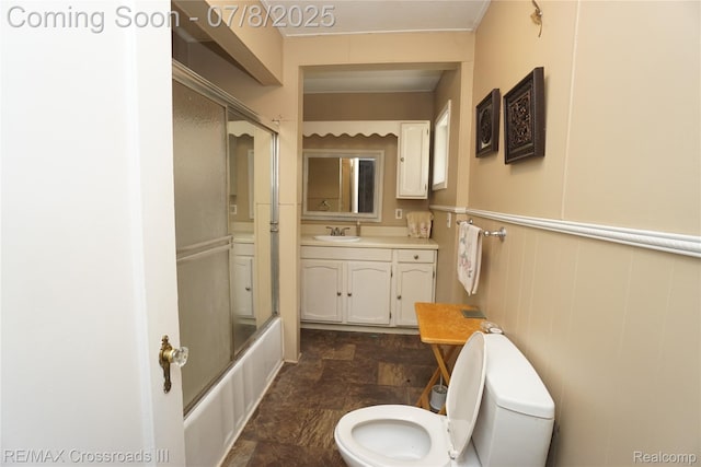 6785 Belleville Rd, Van Buren, MI 48111 - full bathroom featuring vanity, stone finish flooring, and shower / bath combination with glass door