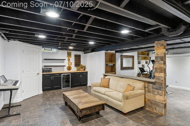 4247 Morningview Dr, Shelby Twp, MI 48316 - living area with wine cooler, a dry bar, and decorative columns