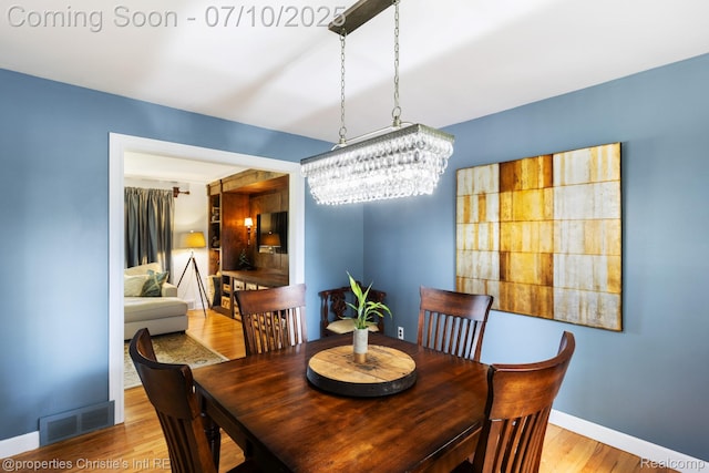 4247 Morningview Dr, Shelby Twp, MI 48316 - dining room with a chandelier and wood finished floors