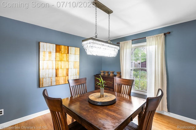 4247 Morningview Dr, Shelby Twp, MI 48316 - dining space with a chandelier and light wood-style flooring