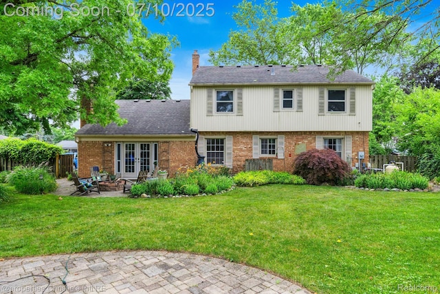 4247 Morningview Dr, Shelby Twp, MI 48316 - rear view of property with brick siding, french doors, a patio area, a chimney, and a shingled roof