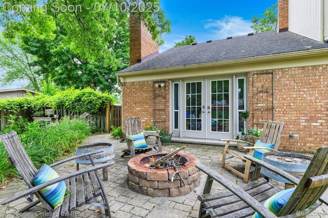 4247 Morningview Dr, Shelby Twp, MI 48316 - view of patio / terrace featuring an outdoor fire pit and french doors