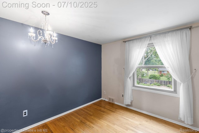 4247 Morningview Dr, Shelby Twp, MI 48316 - empty room with a chandelier and light wood-type flooring