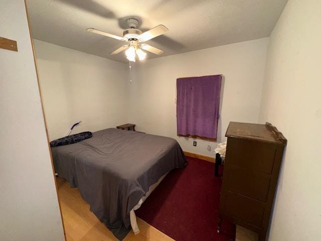 3786 W Houghton Lake Dr, Houghton Lake, MI 48629 - bedroom featuring a ceiling fan